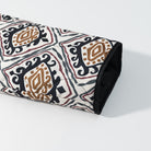 Rolled black and white patterned yoga mat with brown accents, langry fashion apparel