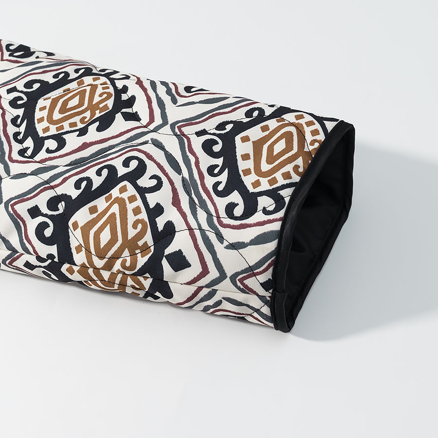 Rolled black and white patterned yoga mat with brown accents, langry fashion apparel