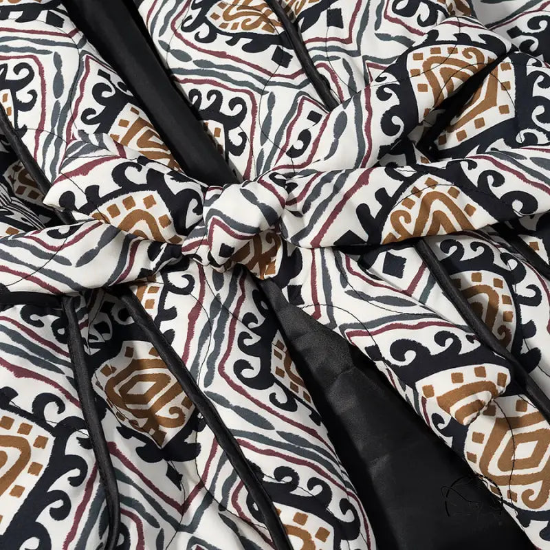 Langry fashion black and white quilted coat with brown accents