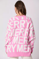 Pink oversized langry fashion sweater with merry graphic on back