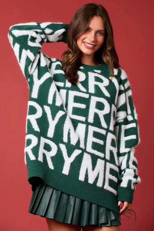 Green oversized langry fashion sweater with merry graphic and faux leather skirt