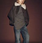 Langry fashion fur-trimmed bomber jacket with plaid shirt and jeans
