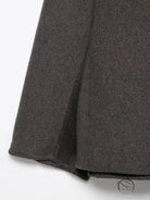 Charcoal gray wool skirt with subtle pleats in fur effect neckline coat