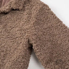 Casual big fur terry coat in light brown faux fur with hood and buttons