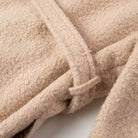 Beige sherpa double breasted overcoat with textured surface