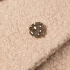White polka dot button on beige Langry double breasted woolen overcoat