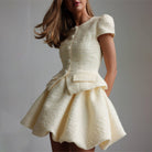 Enchanting short sleeve cream tweed peplum dress with buttons