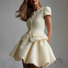 Enchanting short sleeve cream tweed peplum dress with buttons
