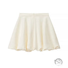 Enchanting short sleeve bud top with cream pleated skirt