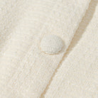 Cream textured short sleeve bud cardigan with button closure