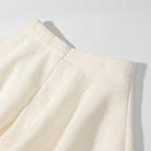 Enchanting short sleeve bud top with cream pleated skirt