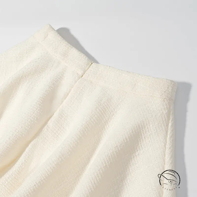 Enchanting short sleeve bud top with cream pleated skirt