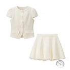 Enchanting short sleeve bud top skirt two piece suit in cream