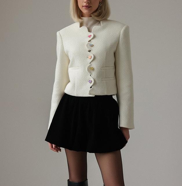 Langry fashion cream textured cropped jacket with white buttons and black skirt