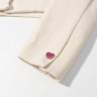 Pink cream textured Langry fashion short coat with heart-shaped gold buttons
