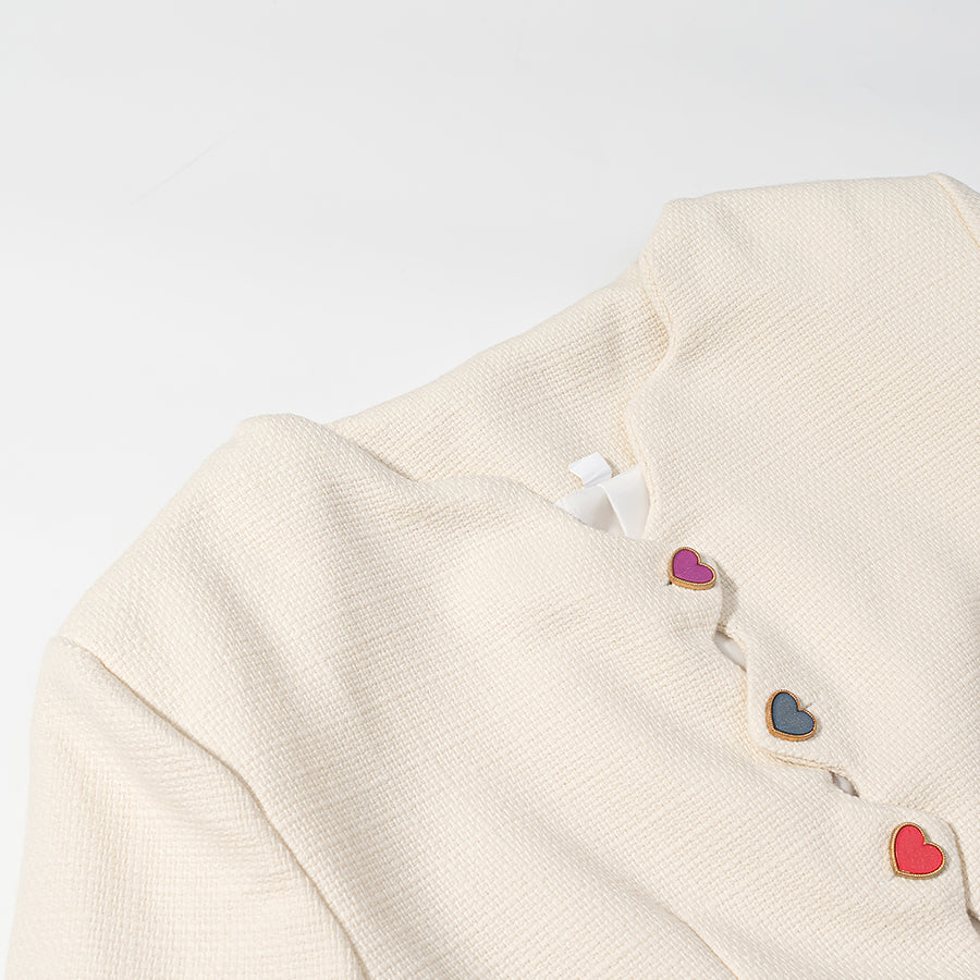 Langry cream cardigan coat with colorful heart buttons and metallic accents