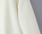 Elegant langry fashion cream scarf for woolen jacket, subtle sheen fabric