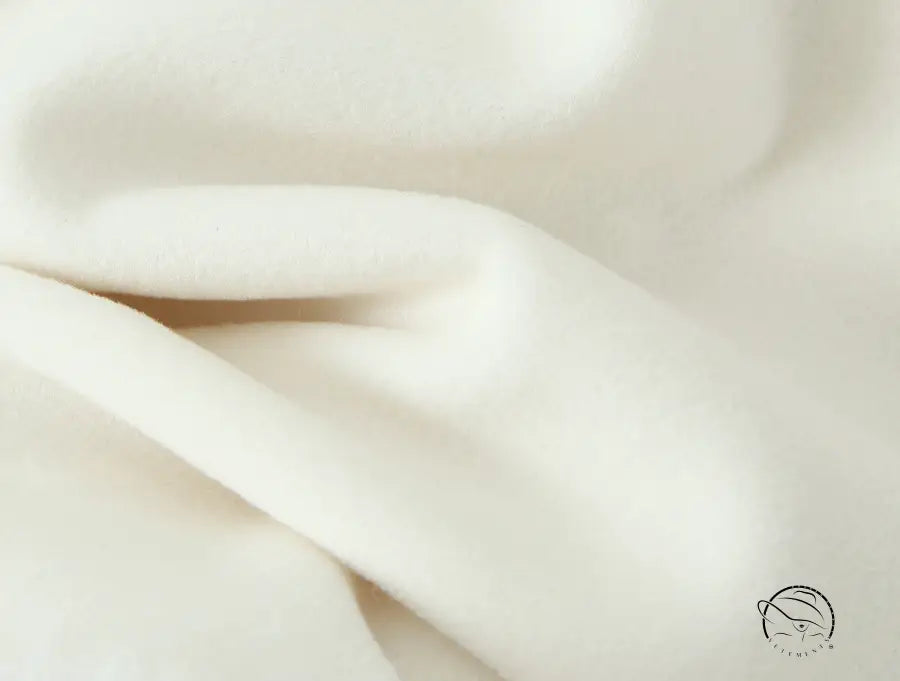 Elegant white silk scarf with soft folds in Langry fashion woolen jacket