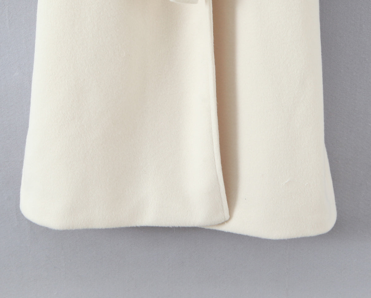 Elegant langry fashion cream cashmere scarf on white wool coat