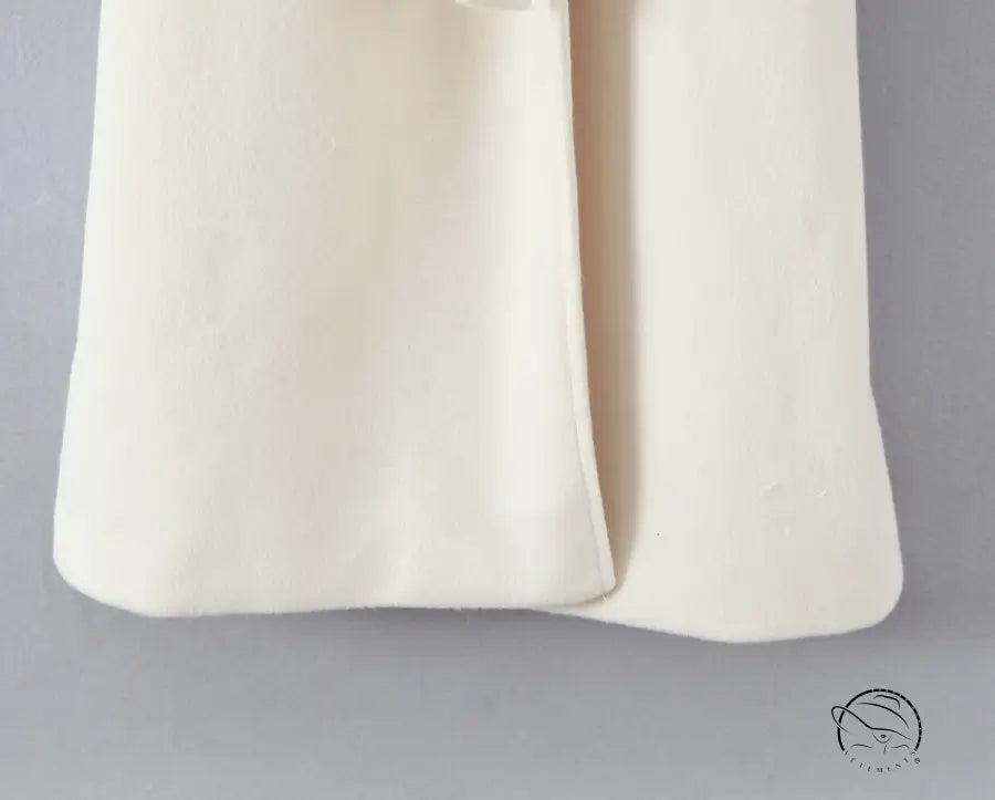 Elegant langry fashion cream cashmere scarf on white wool coat
