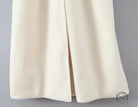 Elegant white woolen coat with cream-colored pleated skirt and slit, langry fashion ملابس