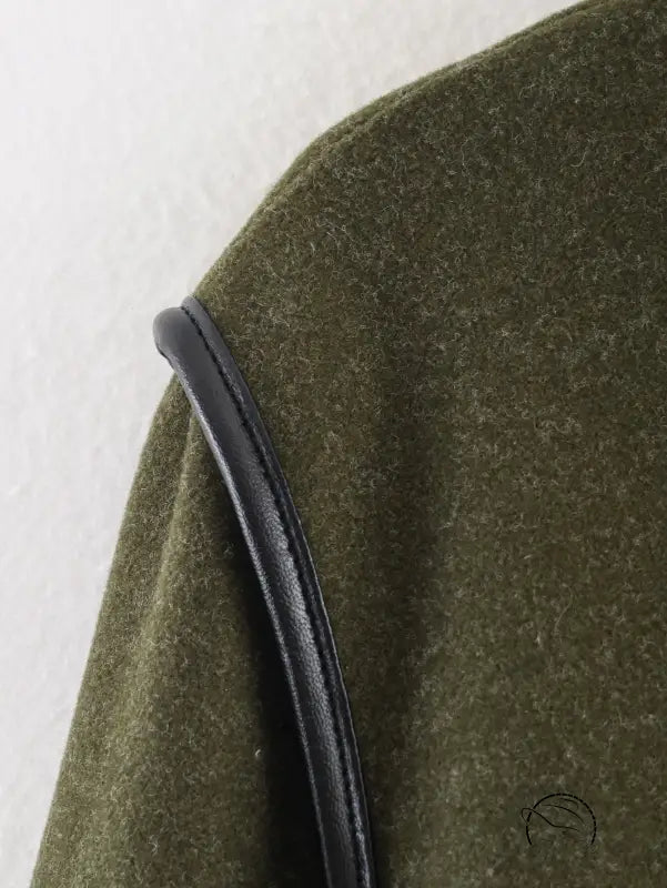 Olive green textured fabric with black leather strap on langry fashion coat