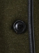 Black button with four holes on textured fabric for Langry fashion woolen coat