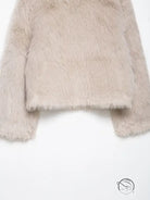 Fashionable beige wool jacket with fluffy faux fur texture