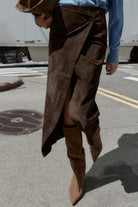 Brown suede sheath long skirt with front slit, asymmetrical hem, pockets, tan boots, Langry fashion ملابس