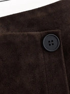 Brown suede fashion jacket with black buttons on langry sheath skirt