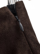 Brown suede langry fashion jacket with silver zipper on sheath skirt