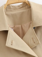 Enchanting Langry short khaki trench coat with patent leather collar and buttons in fashion ملابس