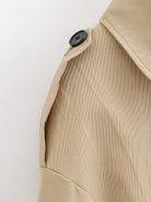 Enchanting Langry short khaki trench coat in beige with black buttons
