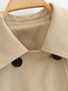 Enchanting Langry short khaki trench coat in beige with black buttons