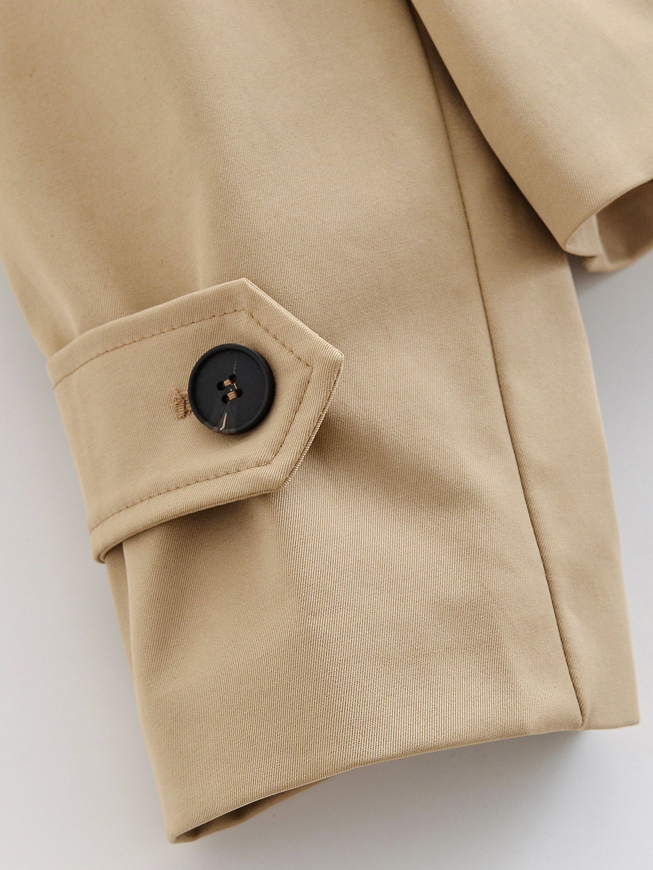 Enchanting Capable Short Khaki Trench Coat in beige with black buttons, classic Langry fashion ملابس