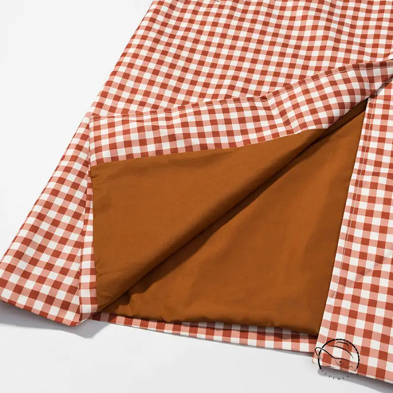 Casual plaid trench coat in red white checkered fabric with brown lining