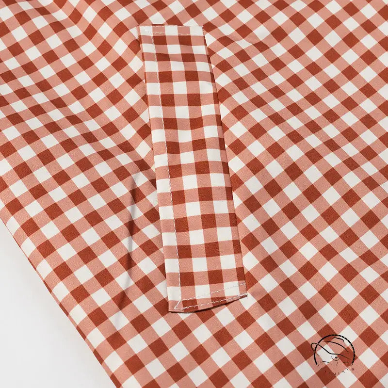 Casual plaid trench coat in red white gingham fabric with pocket detail