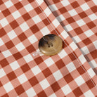 Casual plaid trench coat in red white checkered fabric with gold button