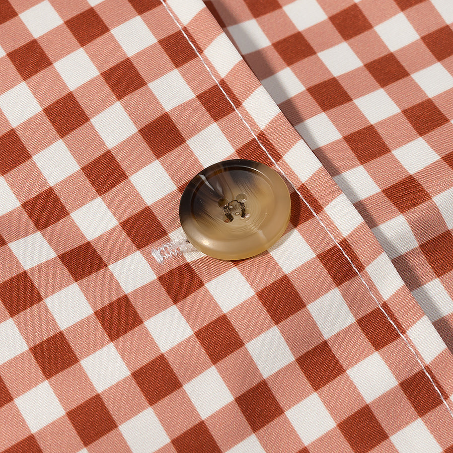 Casual plaid trench coat in red white checkered fabric with gold button