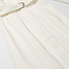 Langry fashion cream pleated skirt with white belt and silver buckle