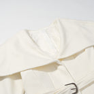 Langry fashion cream-colored patent leather trench coat with black buckle belt