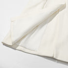 Langry fashion cream-colored woolen blazer with black stitching and pockets