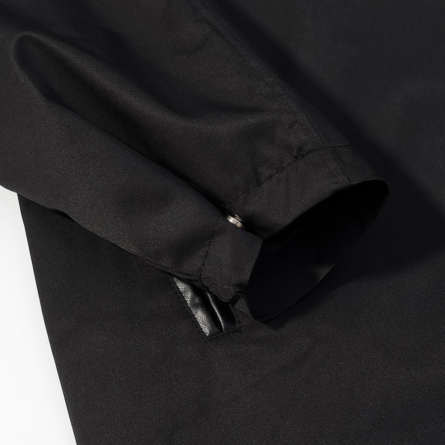 Black zippered pocket detail on Langry fashion trench coat