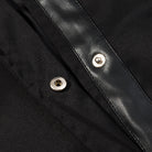 Fashionable black leather langry trench coat with silver snaps and textured lining