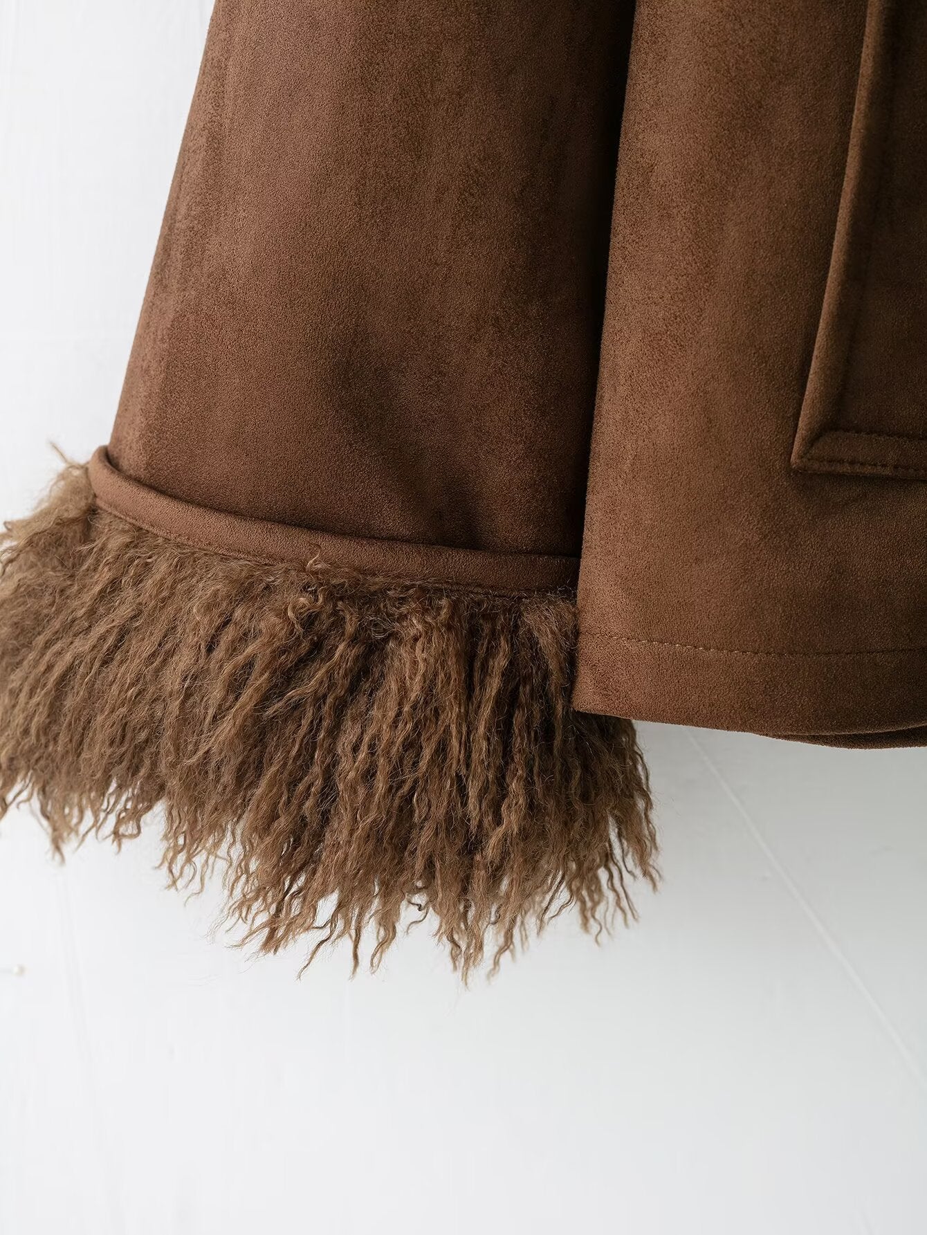 Elegant autumn faux shearling coat in brown suede with fringed hem