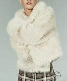 White faux fur effect short coat with frayed shawl and plaid skirt
