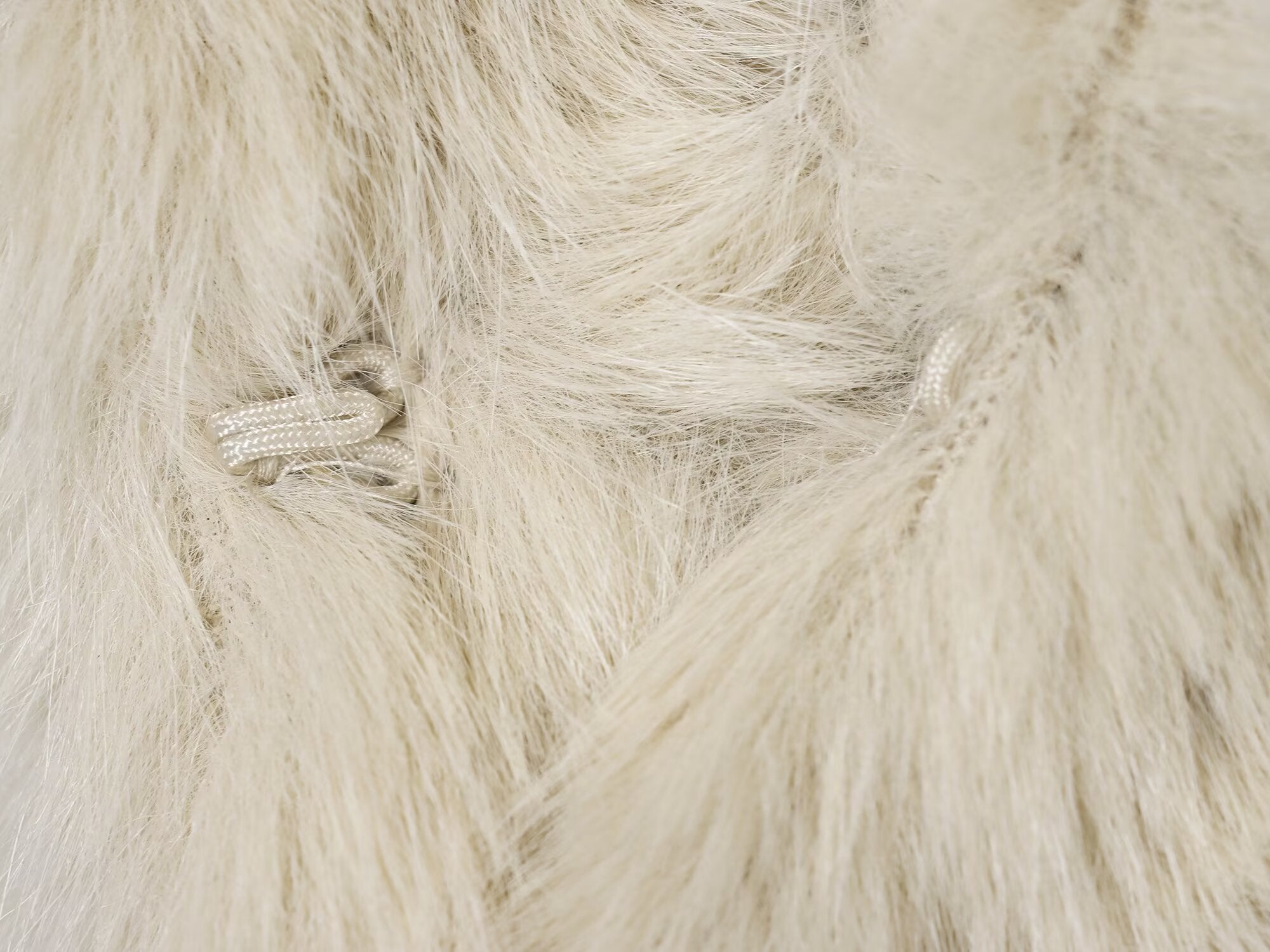 Cream faux fur throw blanket with textured pile and soft sheen for Langry fashion