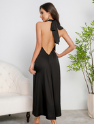 Black satin halter langry dress with back bow, open-back fashion design