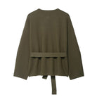 Olive green peplum top with tie waist and long regular sleeves in fashion