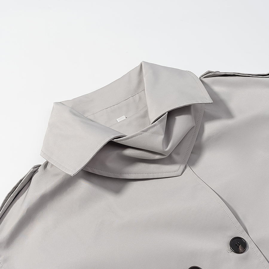 Light gray langry fashion trench coat with double-breasted buttons and black trim